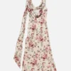 Draperad klänning med blommönster