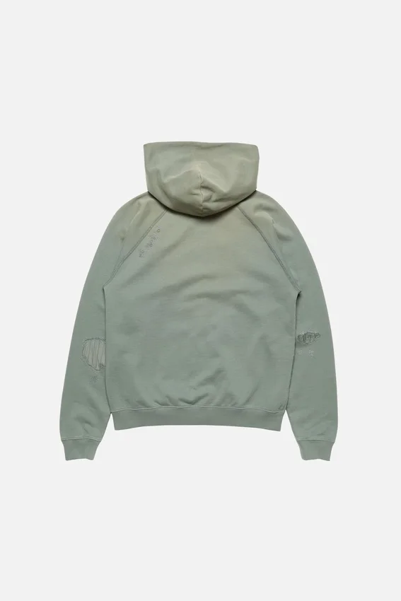 Huvtröja i fleece med lappade detaljer