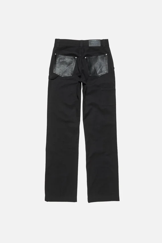 Jeansbyxor med läderlappar