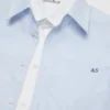 Lager-på-lager-skjorta i poplin med knappar
