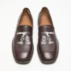 Loafers i tryckt läder