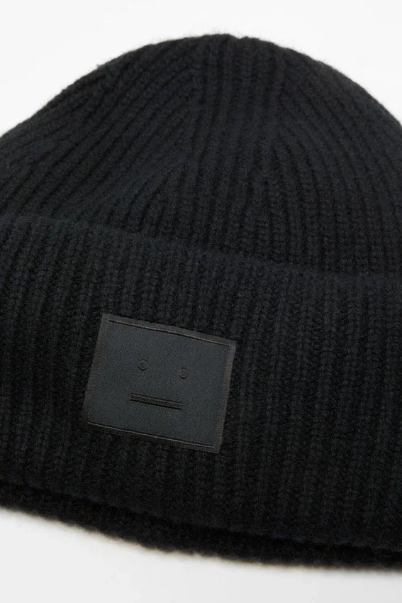 Mössa med Face-logotyp – Yak
